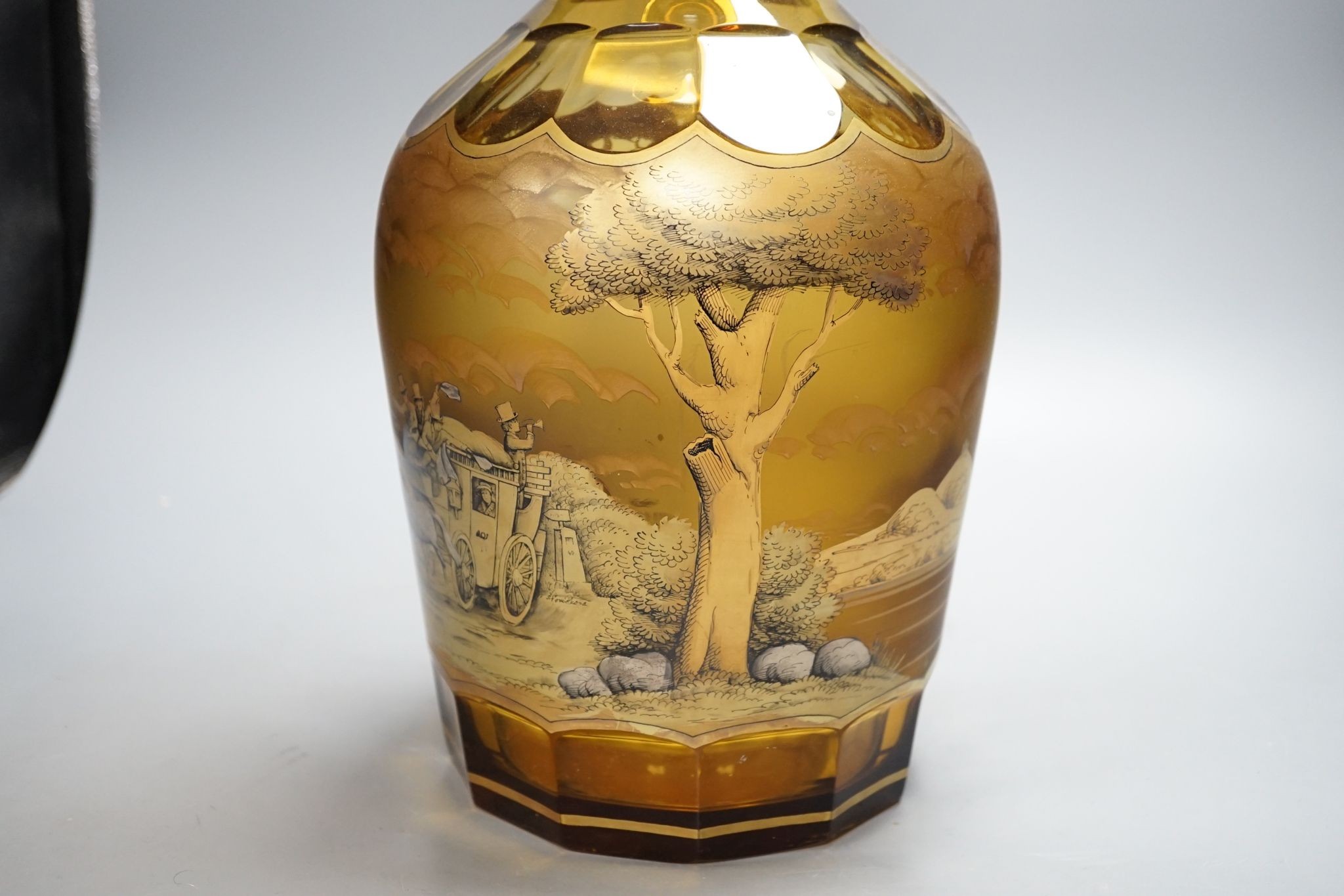 A large amber glass decanter and stopper, 74cm